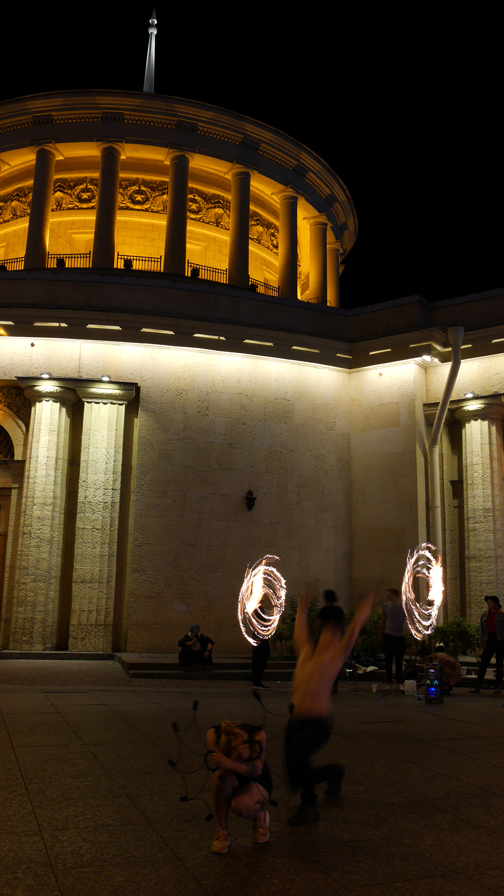 A fire show in front of the Vosstaniya metro station