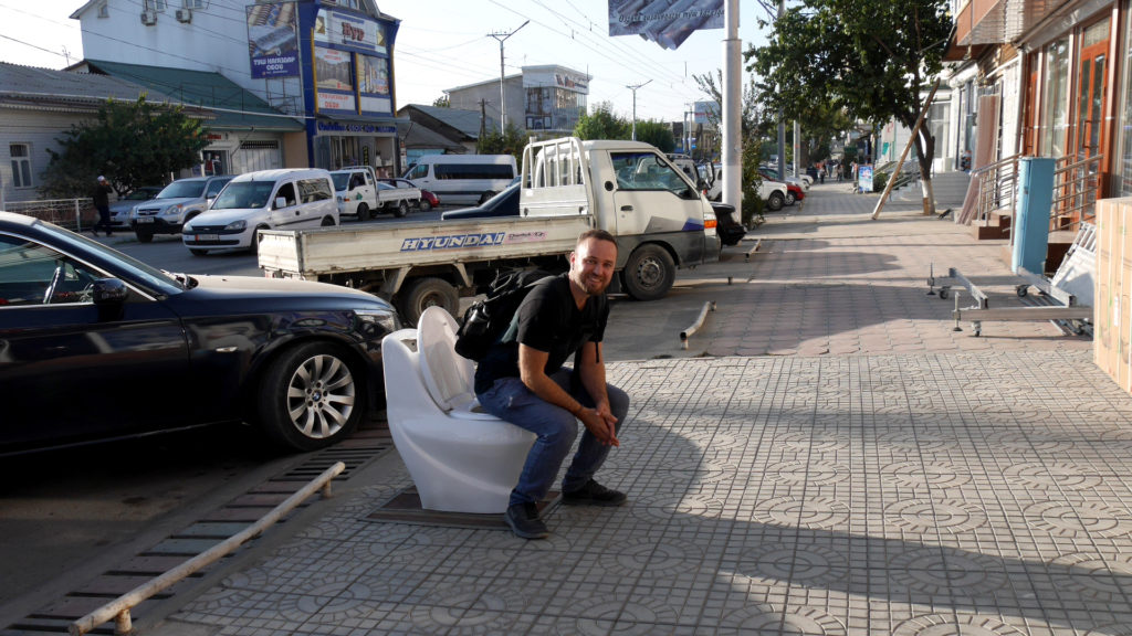 Seri taking a dump on the street with pants on