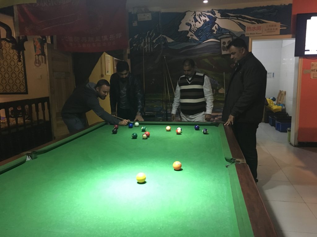 Playing pool at the hostel (and sucking at it)