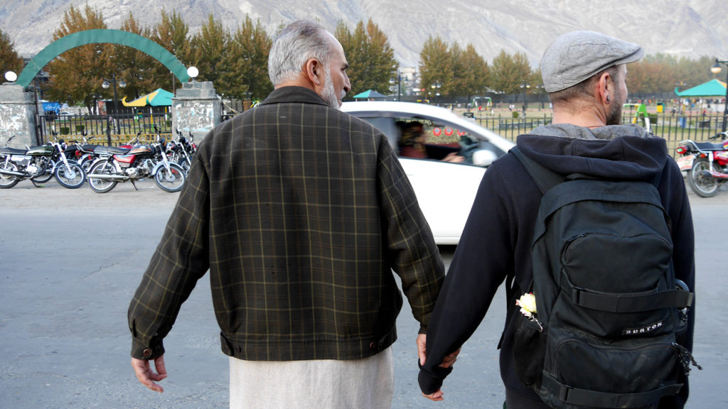 Jamil making sure that Seri can safely cross the street