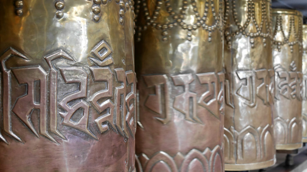 There are prayer wheels all around