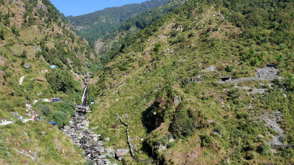 On the left side: the path leading to the waterfall. In the middle: the waterfall and the river. On the right side: the shrine