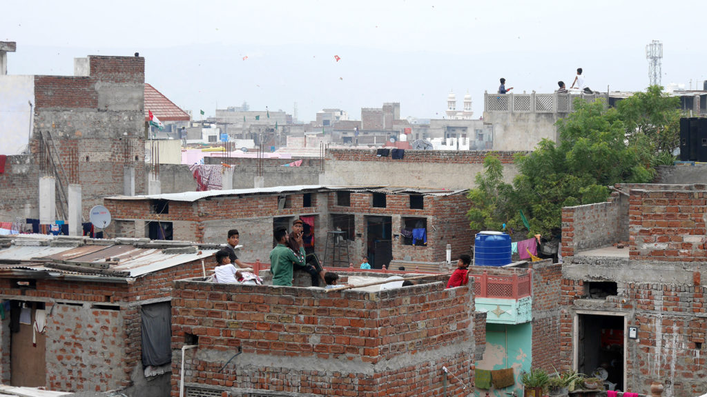 Boys flying kites over Jaipur