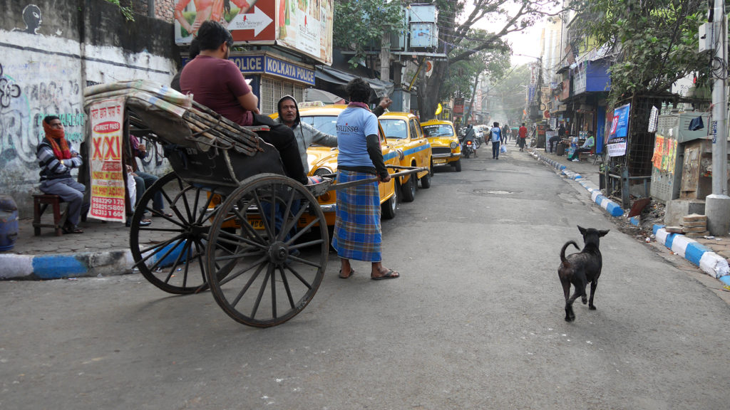 The other end of Sudder Street and typical transportation in Kolkata