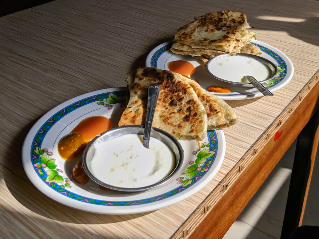 Alu paratha is often served with raita