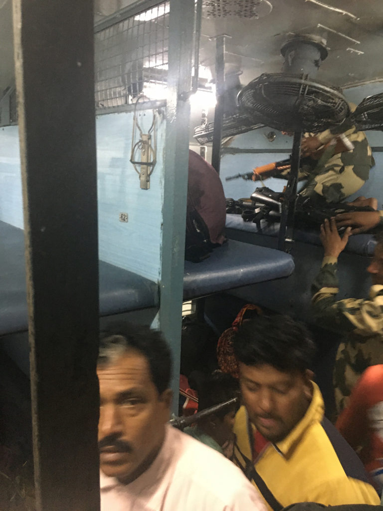 Men piling up the rifles on the upper bunk