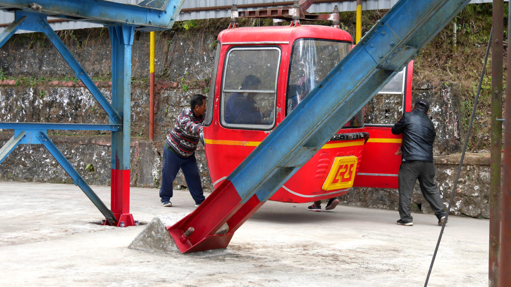 The workers stopping the car to let people out