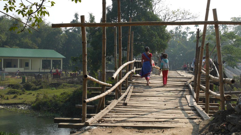 Girls crossing a bridge