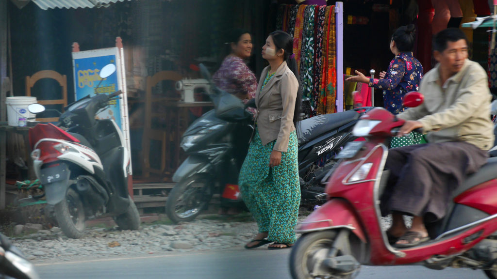 Many people around here use the light coloured thanaka paste as make-up and/or sun protection